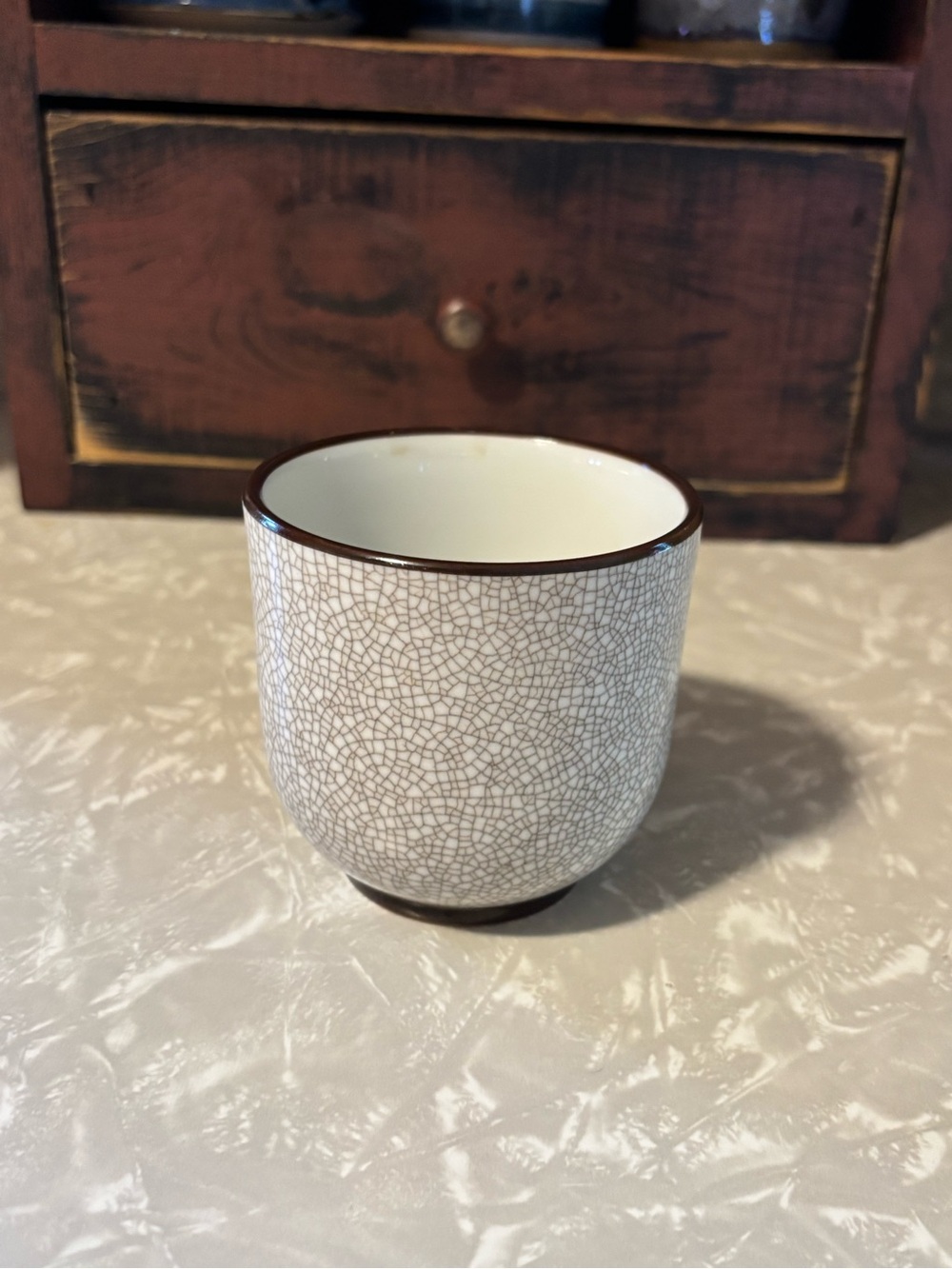 Bing & Grøndahl Ceramic Crackle Glaze Tea Cup - White with Brown Rim